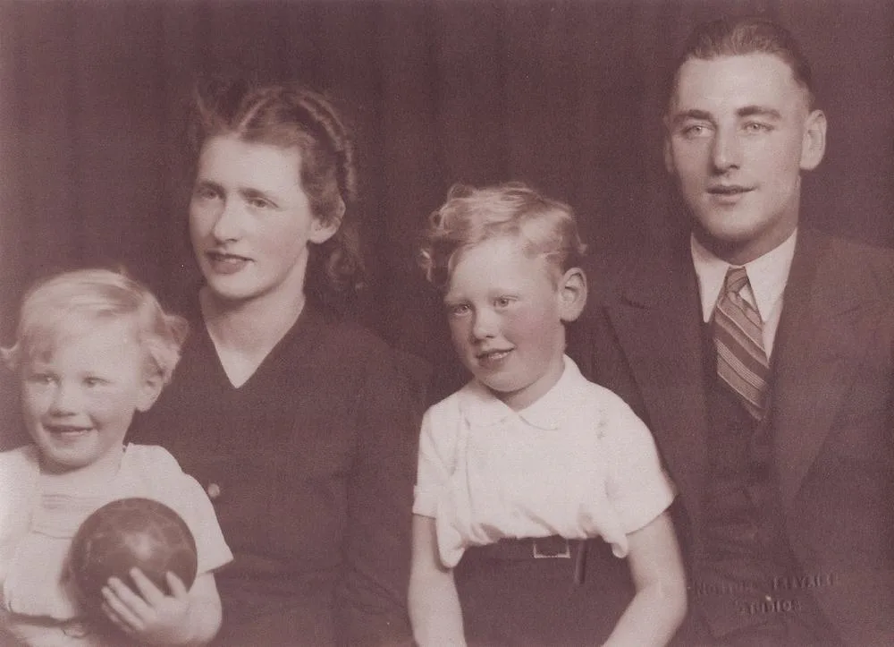 A 1940 studio portrait of a mother and father with their two small sons, with a box drawn round each face.